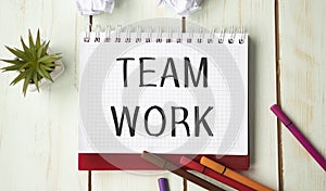 Team Work text in notepad with a business objects