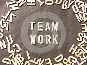 Team Work Word In Wooden Cube Alphabet Letters Top View On A rustic paper Background