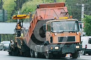 Team of workers in protective uniforms work on road construction. Road works