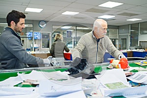 Team workers sorting waste