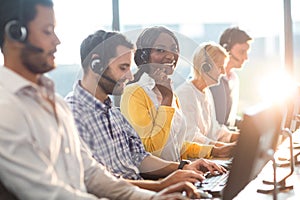 Team working on computer with headset