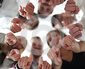 team of young business people pointing at you