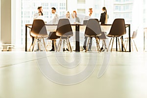 A team of young businessmen working and communicating together in an office. Corporate businessteam and manager in a