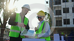 Team young engineer or architect meeting and planning installation solar panel at construction site.