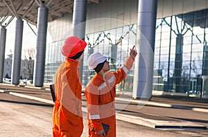 Team of young engineers discussing a construction project