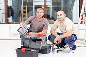 Teammate Electricians With Tool Boxes photo