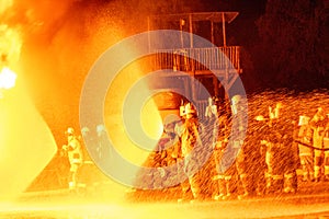 Teams of Firefighters working a fire