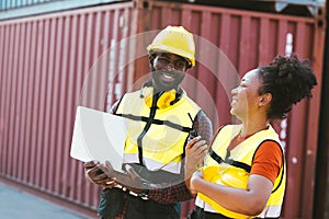 Teamwork, African worker couple happy working together port cargo shipping industry container yard