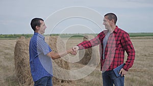 Teamwork agriculture smart farming concept. two men farmers business having firm friendly handshake workers shake hands