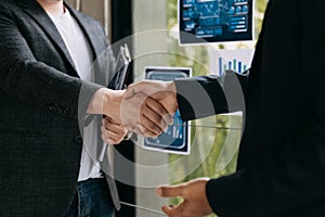 Teamwork business concept of group of three coworkers join hand together during their meeting