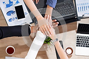 Teamwork business people join hands in meeting