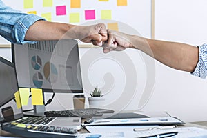 Teamwork of businesspeople partnership giving fist bump to greeting start up business strategy project
