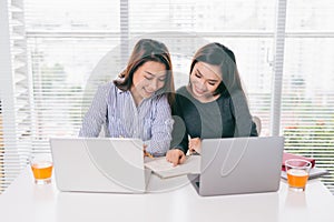 Teamwork. Businesspeople working together with laptop in office.