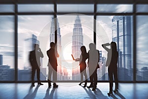 Teamwork and colleagues concept. Group of businesspeople working together in modern office interior with bright city view