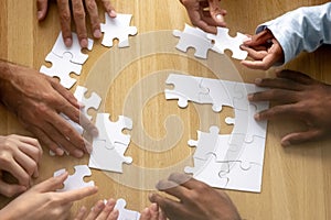 Teamwork concept, business team people hands assemble puzzle together