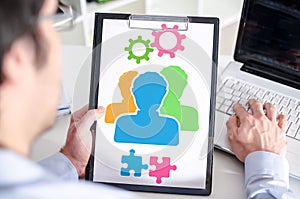 Teamwork concept on a clipboard