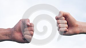 teamwork concept. fist to fist commit solidarity respect and brotherhood gesture. business team hands fists close-up