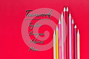 Teamwork concept. group of color pencil on red background with word Teamwork, Together, Everyone, Achieves and More