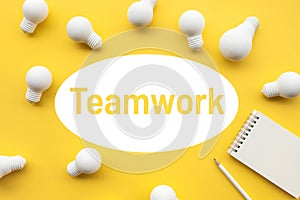 Teamwork concepts with group of lightbulb and notepad on pastel color background.Business solution