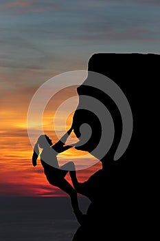 Teamwork couple hiking help each other trust assistance silhouette in mountains, sunset. Teamwork of man and woman hiker helping e