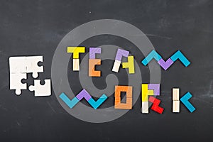 Teamwork creative concept concept jigsaw on the blackboard