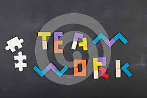 Teamwork creative concept concept jigsaw on the blackboard