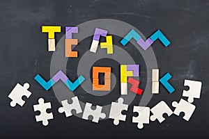 Teamwork creative concept concept jigsaw on the blackboard