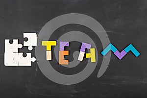 Teamwork creative concept concept jigsaw on the blackboard