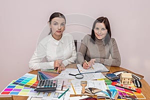 Teamwork of creative designers working with colour palette