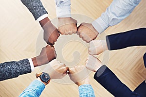 Teamwork, fist bump or hands of business people together for motivation, group support or community. Collaboration, team