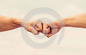 Teamwork and friendship. Partnership concept. Man giving fist bump. Bumping fists together. Fist Bump. Clash of two