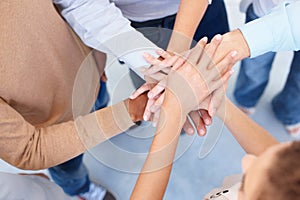 Teamwork, group and hands stacked for collaboration, unity or motivation of business, community or team. People, support