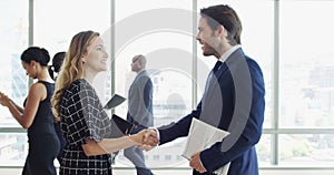 Teamwork, happy or business people shaking hands in meeting for negotiation or company agreement. Office, handshake or