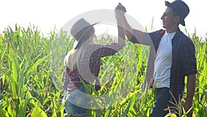 Teamwork happy family smart farming concept slow motion video. girl and man shake hands meeting business contract