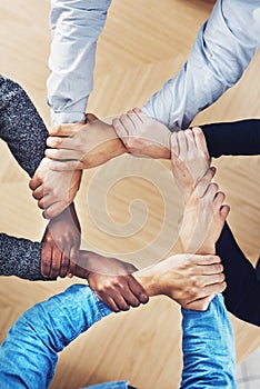 Teamwork, holding or hands of business people with diversity for office support or collaboration. Trust, link or above