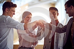 Teamwork  join hand together .business team putting hands