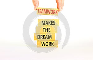 Teamwork makes dream work symbol. Concept words Teamwork makes the dream work on wooden blocks on beautiful white background.