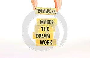 Teamwork makes dream work symbol. Concept words Teamwork makes the dream work on wooden blocks on beautiful white background.