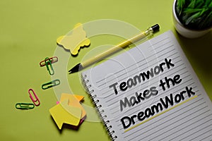Teamwork Makes The Dreamwork write on a book isolated on office desk photo
