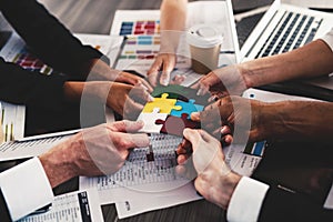 Teamwork of partners. Concept of integration and startup with puzzle pieces