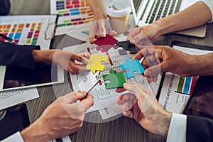 Teamwork of partners. Concept of integration and startup with puzzle pieces