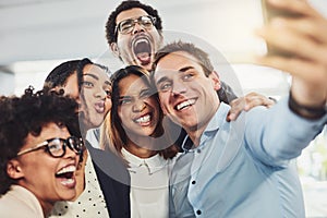 Teamwork, playful and selfie while a group of cheerful businesspeople making funny faces together for a social media