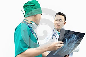 Teamwork of professional doctor men medical team consulting with x-ray film in hospital.Health care and teamwork  medical concept