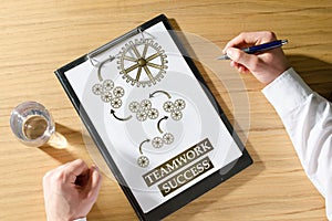 Teamwork success concept on a desk