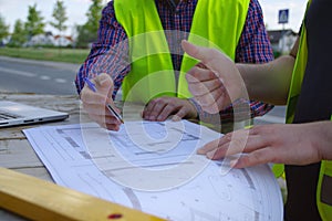 Teamwork success. Engineer and worker at a construction site