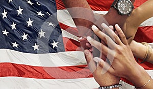 Teamwork, support and hands stacked on American flag for community together in collaboration for the country. Group