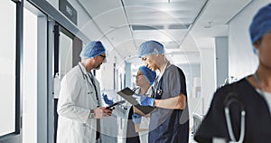 Teamwork, talking and doctors with a tablet at a hospital for health advice or surgery communication. Help, clinic and