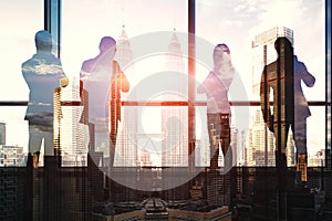 Teamwork and team building concept with group of business people near glass wall with city view background