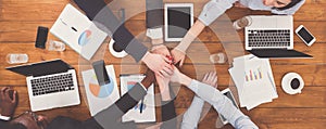 Teamwork and teambuilding concept in office, people connect hand