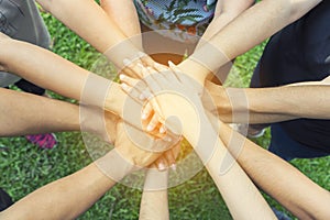 Teamwork togetherness collaboration concept, People group join hands together unity symbol during, stacked huddle together,